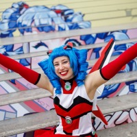 The mascot of Manga Comic Com 2025, Macoco, smiles for the camera. 