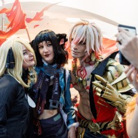 Three cosplayers take a photo together at Manga Comic Con 2025.