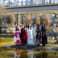Group of cosplayers posing in front of the Glass Hall at the Manga Comic Con 2025
