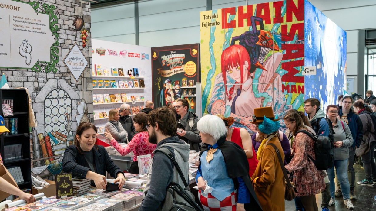 Visitors are standing in line at a booth at the Manga-Comic-Con 2025
