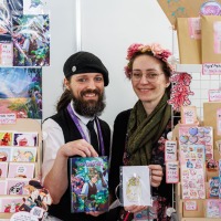 Two vendors at their sticker booth at the Manga-Comic-Con 2025