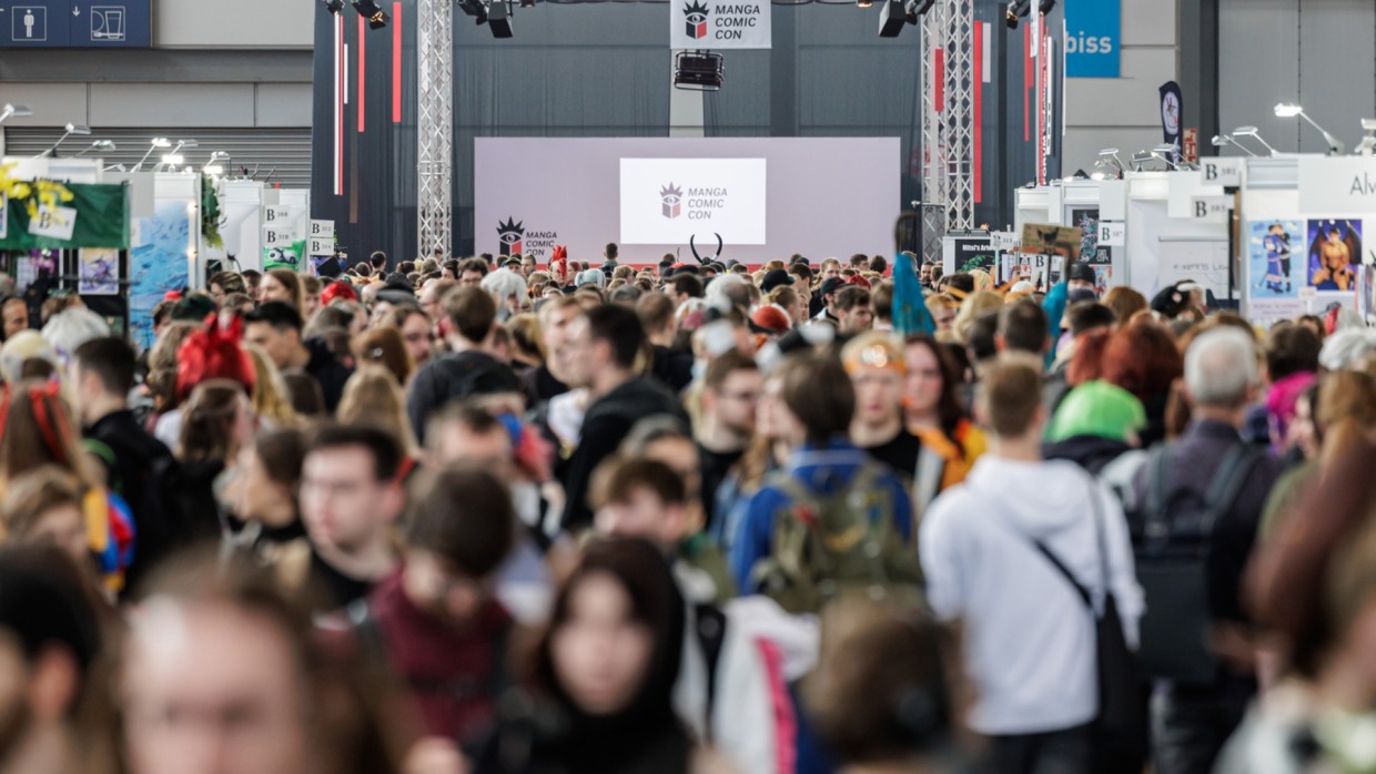 crowded trade fair hall with many booths and visitors during Manga Comic Con 2026