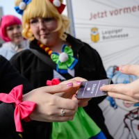 Close-up of a ticket handover.